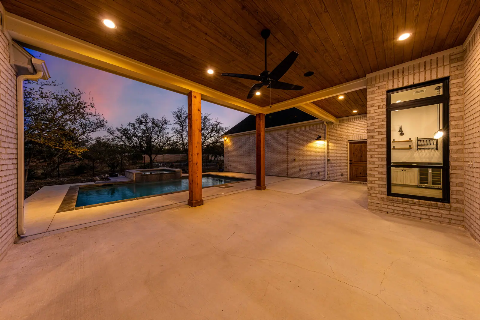 Covered patio, Farmhouse Hill Country Retreat (RenovatePros project)
