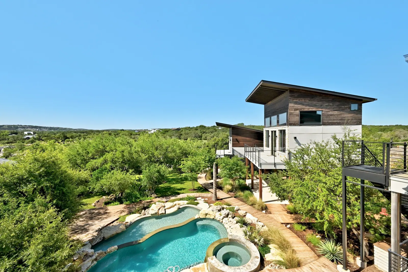 Pool and homes, Spicewood Lake Retreat (RenovatePros project)