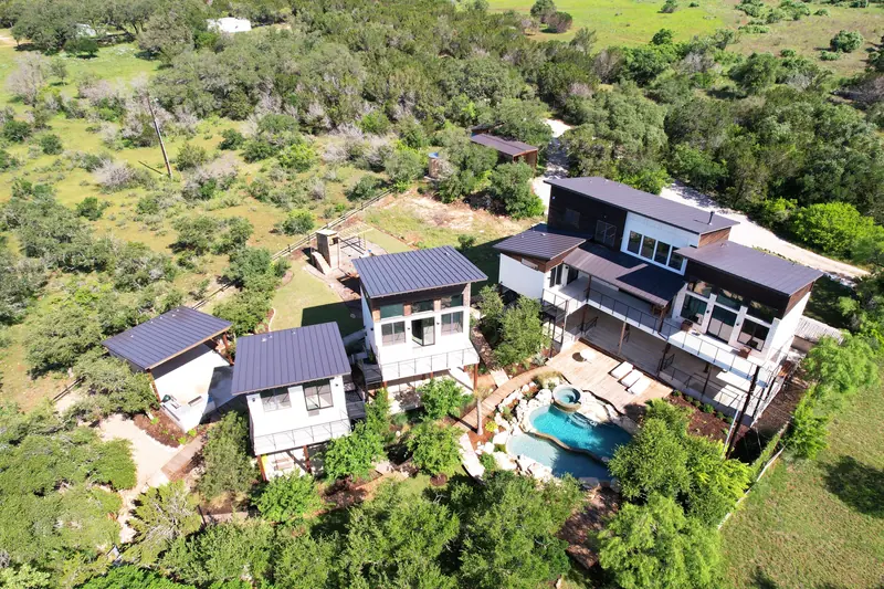 Aerial view of the three homes, Spicewood Lake Retreat (RenovatePros project)