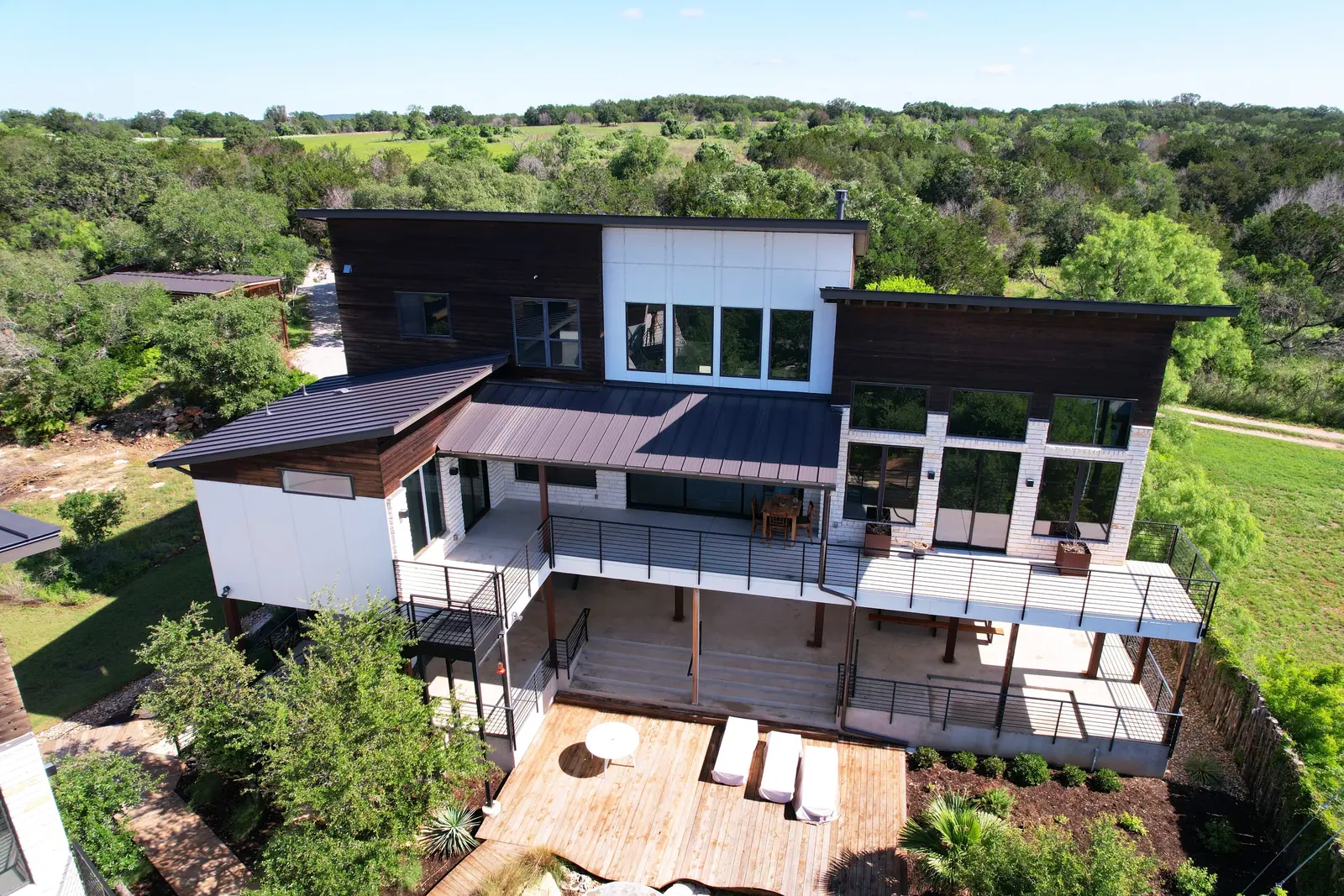 Aerial view of the three homes, Spicewood Lake Retreat (RenovatePros project)