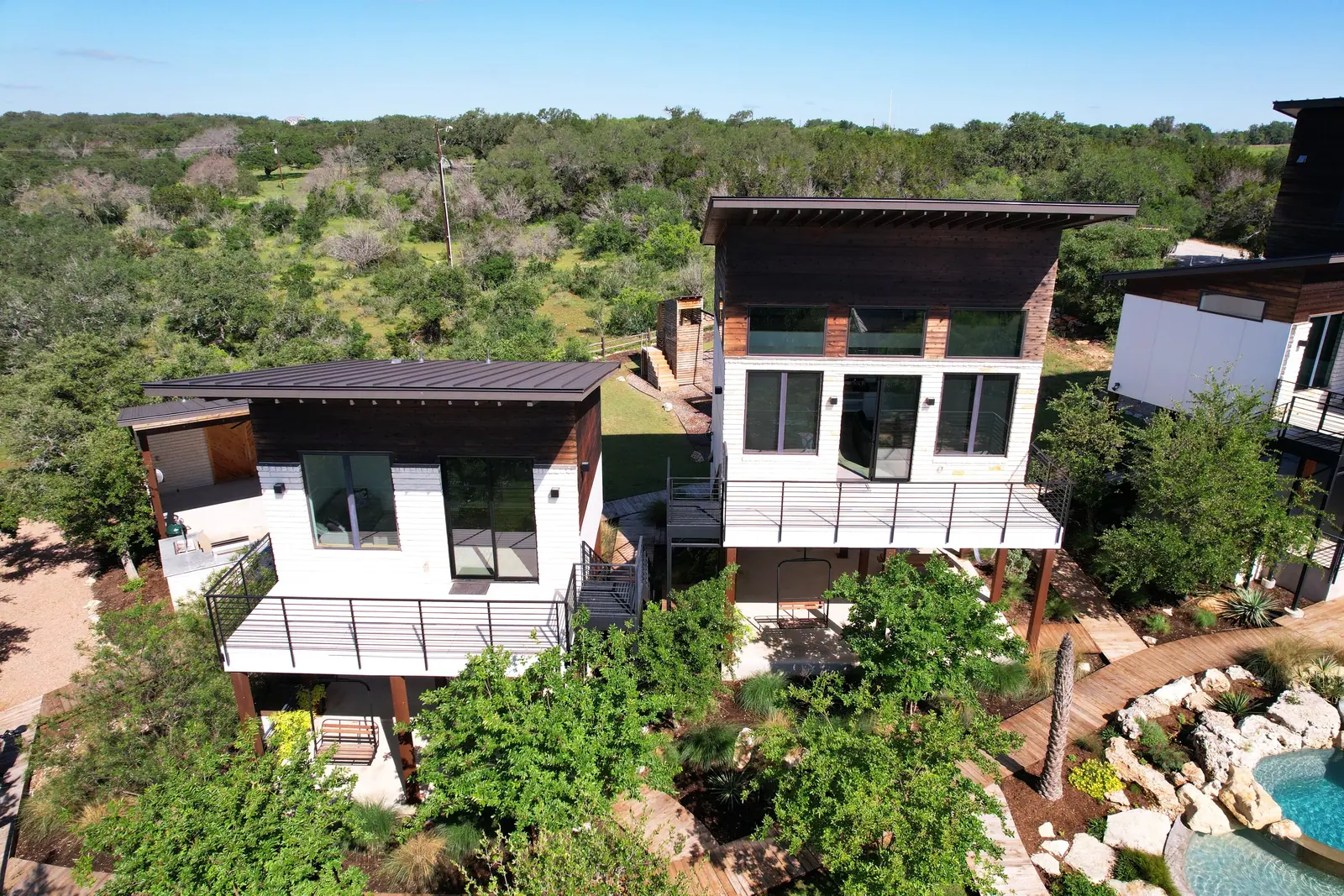 Aerial view of the three homes, Spicewood Lake Retreat (RenovatePros project)