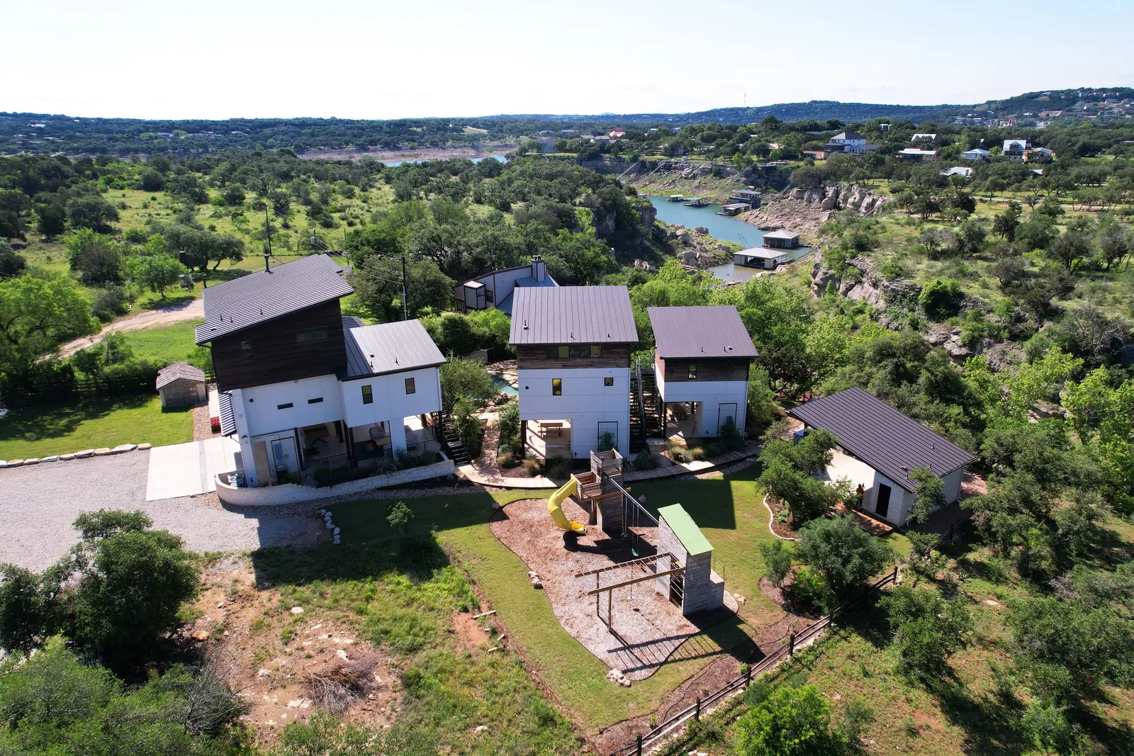 Aerial view of the three homes, Spicewood Lake Retreat (RenovatePros project)