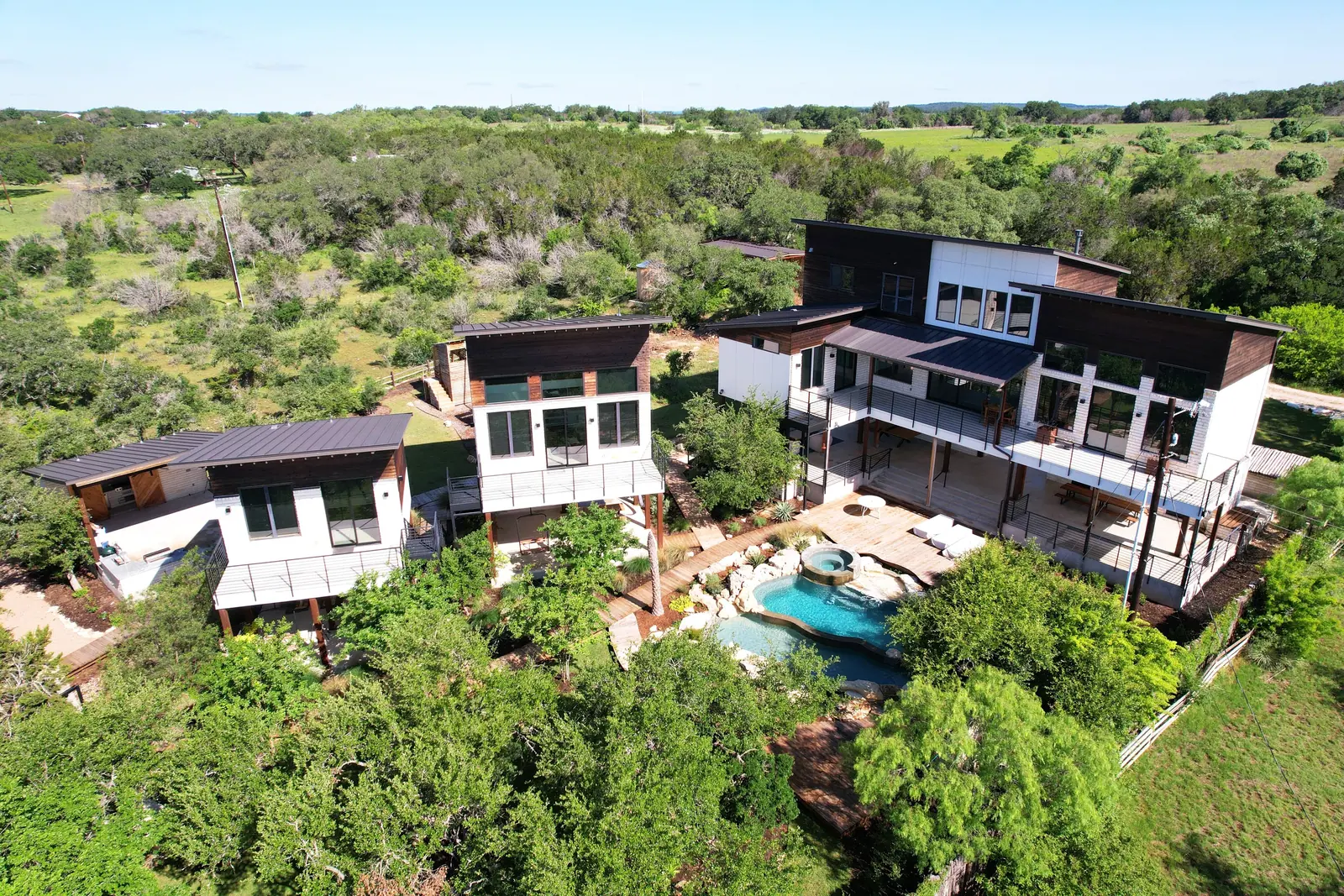 Aerial view of the three homes, Spicewood Lake Retreat (RenovatePros project)