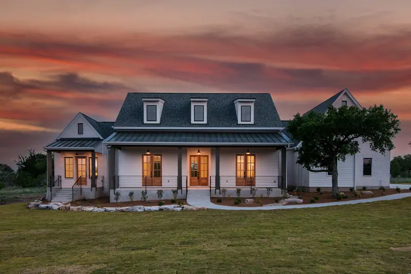 Exterior at dusk, Spicewood Modern Farmhouse (RenovatePros project)